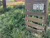 Pallet letterbox in a matured garden